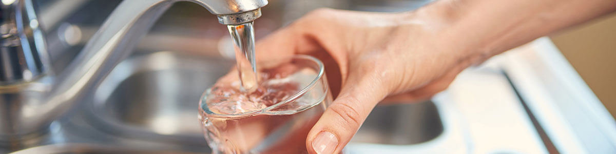 drinking-water-pouring-from-faucet-banner